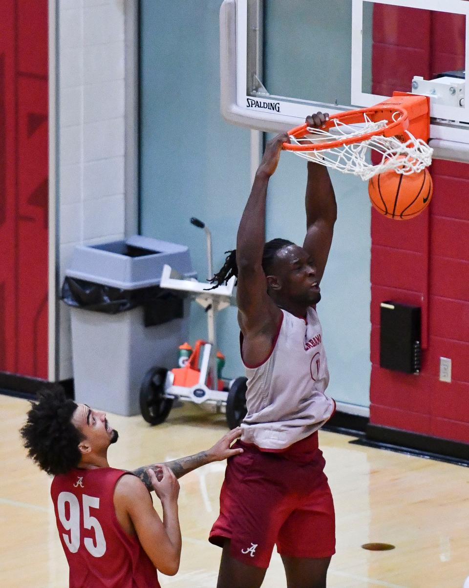 The University of Alabama men’s basketball team works out in practice Thursday, Sept. 26, 2024. Alabama center Clifford Omoruyi (11) dunks against Alabama Houston Mallette (95).