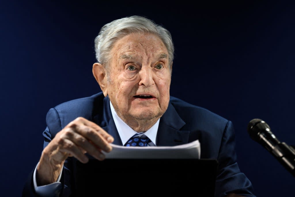 George Soros addresses the assembly on the sidelines of the World Economic Forum (WEF) meeting in Davos on Tuesday (AFP via Getty Images)