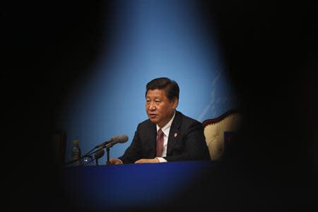 China's President Xi Jinping delivers a speech to the media during the fourth Conference on Interaction and Confidence Building Measures in Asia (CICA) summit, in Shanghai May 21, 2014. REUTERS/Carlos Barria