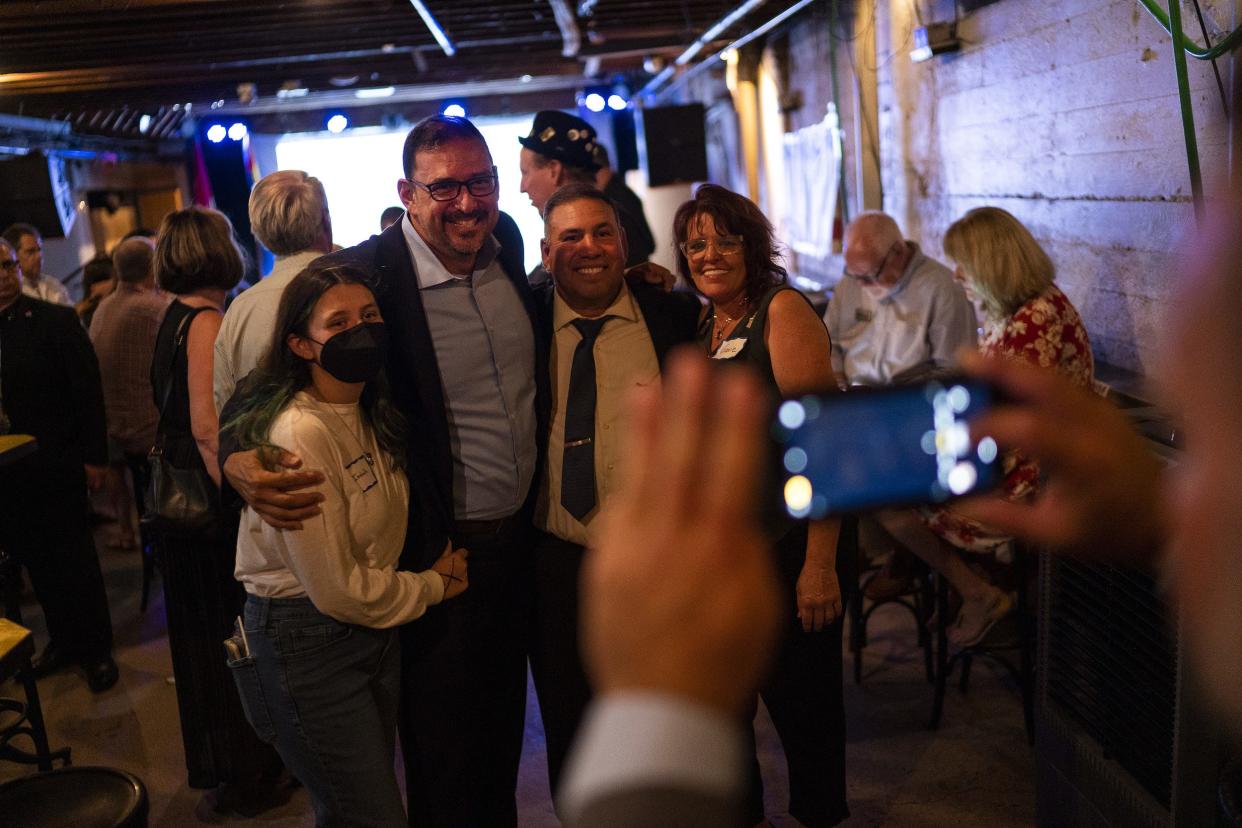 Adrian Fontes, candidate for secretary of state, takes a photo with constituents during a watch party for the Arizona primary at Valley Bar on Aug. 2, 2022, in Phoenix.