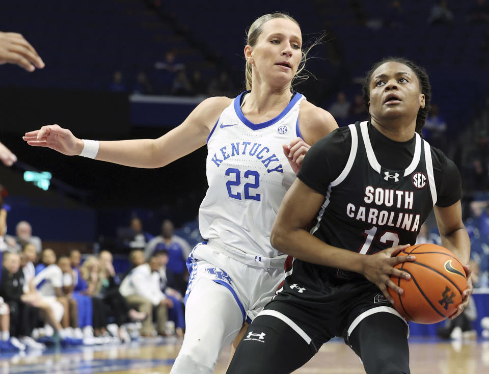 South Carolina's MiLaysia Fulwiley, right, is pressured by Kentucky's Maddie Scherr (22) during the second half of an NCAA college basketball game Sunday, Feb. 25, 2024, in Lexington, Ky. South Carolina won 103-55. (AP Photo/James Crisp)