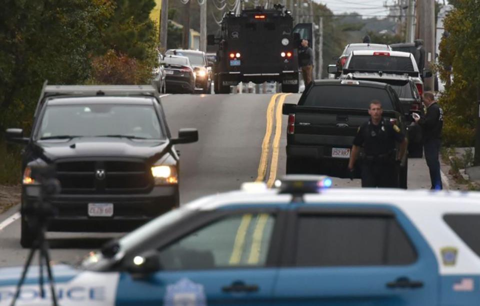 Cape Cod police and SWAT teams investigate the area of a fatal shooting on Yarmouth Road in Hyannis, Oct. 16, 2019.