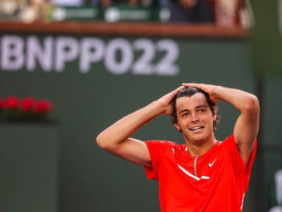 Taylor Fritz of the United States reacts to winning the ATP singles title over Rafael Nadal of Spain at the BNP Paribas Open at the Indian Wells Tennis Garden in Indian Wells, Calif., Sunday, March 20, 2022. 