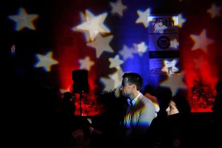 People watch a broadcast of the U.S. presidential race between Democratic nominee Hillary Clinton and Republican nominee Donald Trump in a restaurant in Mexico City, Mexico November 9, 2016. REUTERS/Carlos Jasso