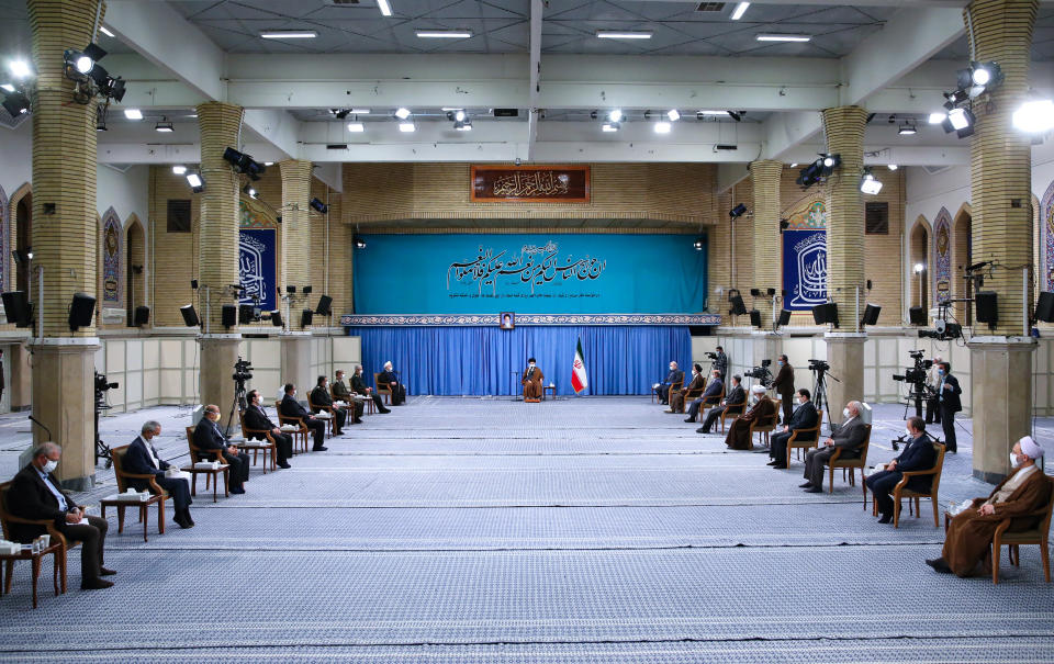 In this picture released by the official website of the office of the Iranian supreme leader, Supreme Leader Ayatollah Ali Khamenei, wearing a mask to prevent COVID-19, attends a meeting with National Corona Headquarters, in Tehran, Iran, Saturday, Oct. 24, 2020. (Office of the Iranian Supreme Leader via AP)