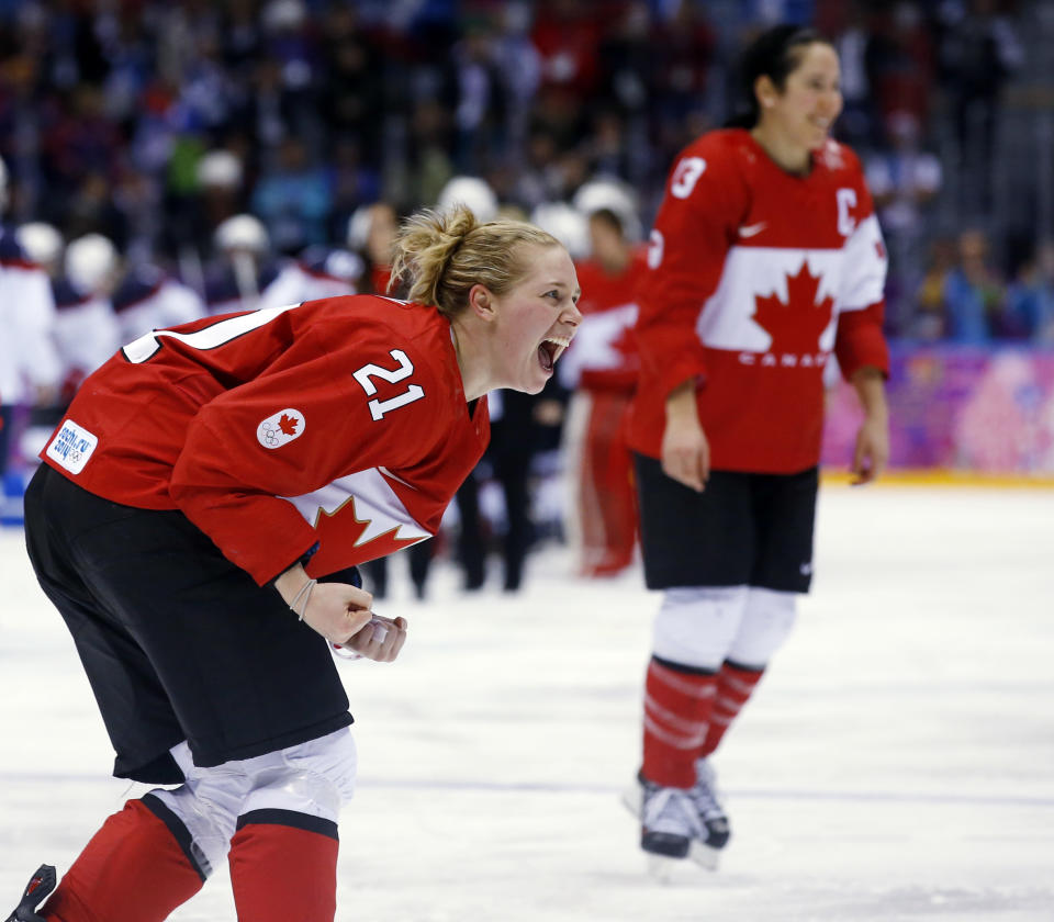 Haley Irwin of Canada (21) reacts after Canada beat the USA 3-2 to win the women's gold medal ice hockey game in overtime at the 2014 Winter Olympics, Thursday, Feb. 20, 2014, in Sochi, Russia. (AP Photo/Matt Slocum)