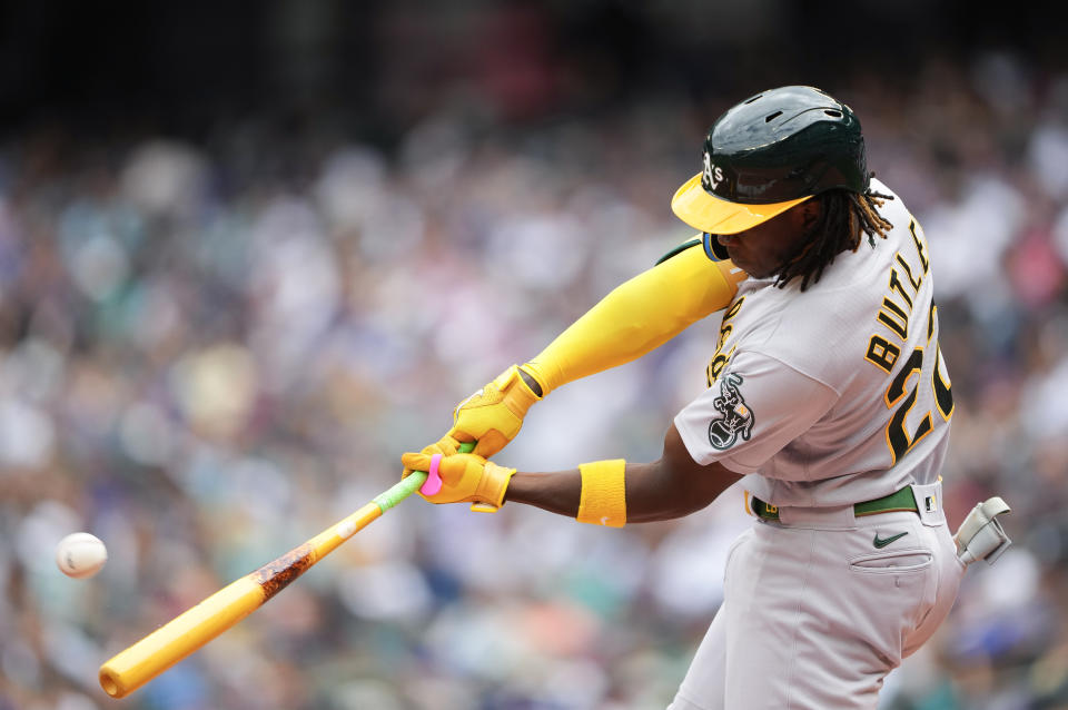 Oakland Athletics' Lawrence Butler hits a two-run home run against the Seattle Mariners to score Jordan Diaz during the second inning of a baseball game, Wednesday, Aug. 30, 2023, in Seattle. (AP Photo/Lindsey Wasson)