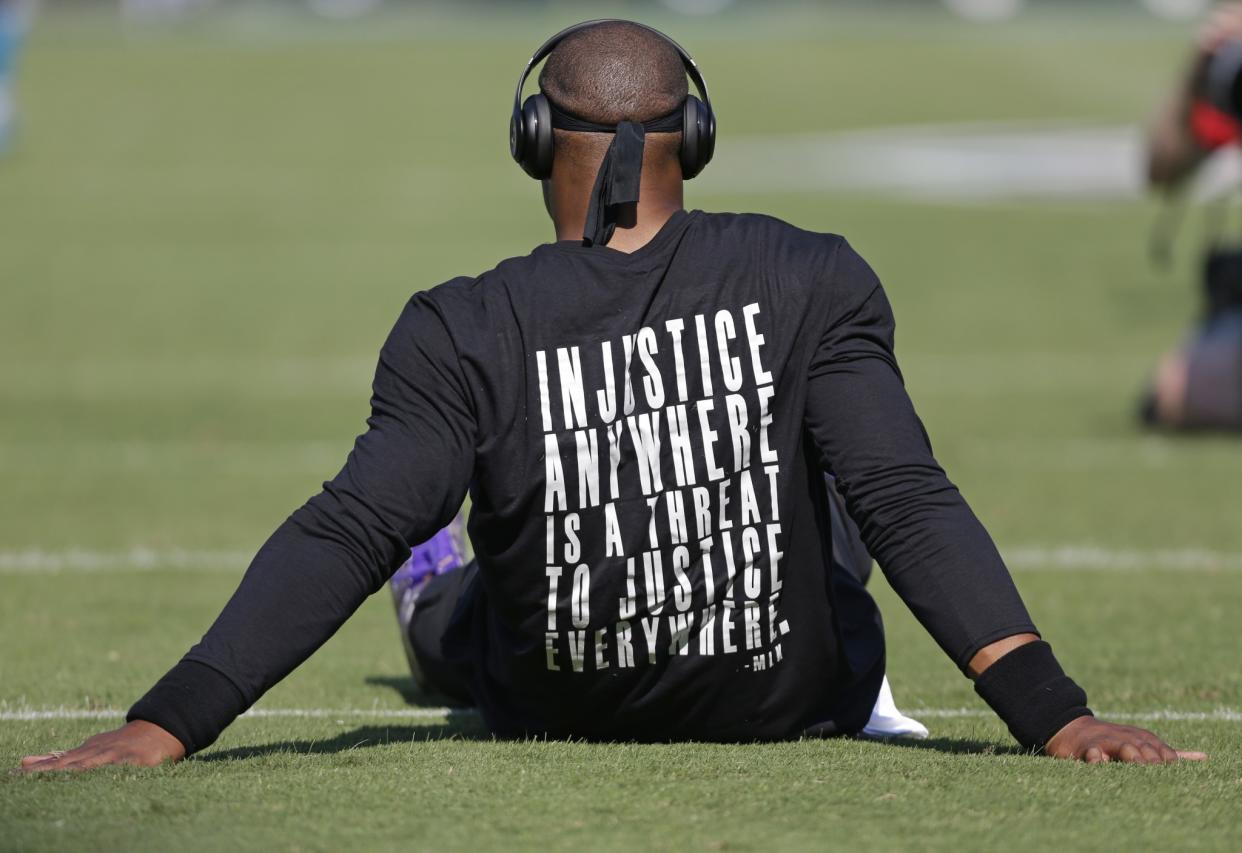 Cam Newton wore a shirt with a Martin Luther King Jr. quote before the Carolina Panthers' game against the Minnesota Vikings (AP).