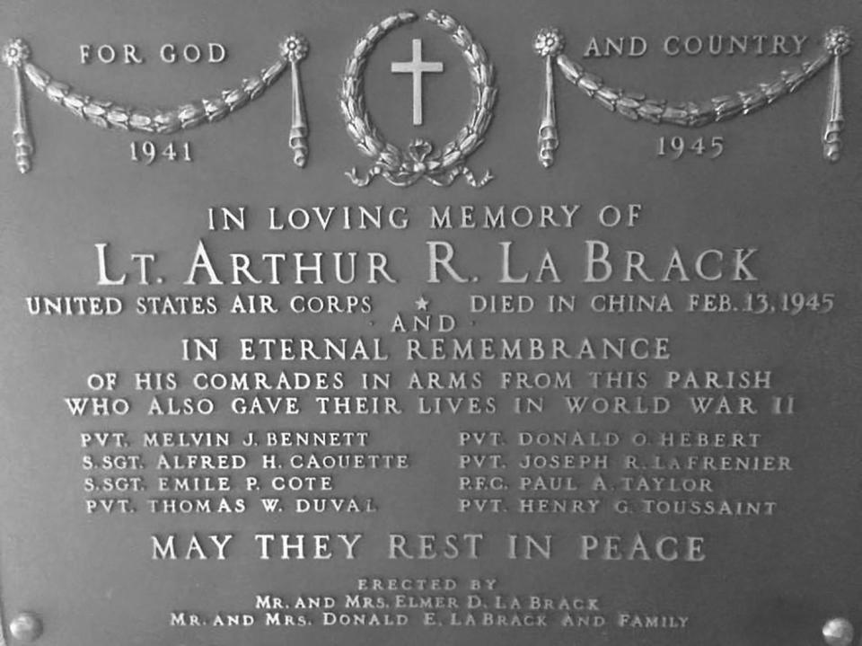 The bronze marker that was located at the former St. Ann's Church in South Ashburnham, memorializing the parishioners from the church who died in World War II.