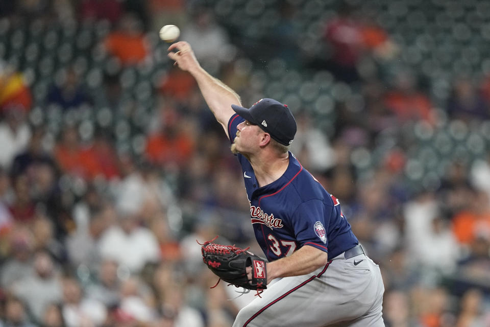 Minnesota Twins starting pitcher Dylan Bundy throws against the Houston Astros during the first inning of a baseball game Wednesday, Aug. 24, 2022, in Houston. (AP Photo/David J. Phillip)