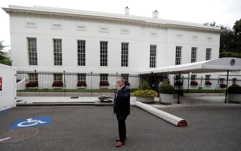 Former White House Press Secretary and Communications Director Sean Spicer stands alone on West Executive Drive outside the West Wing (Rear) during a press tour of renovations at the White House in Washington, U.S. August 11, 2017 - Credit: Reuters