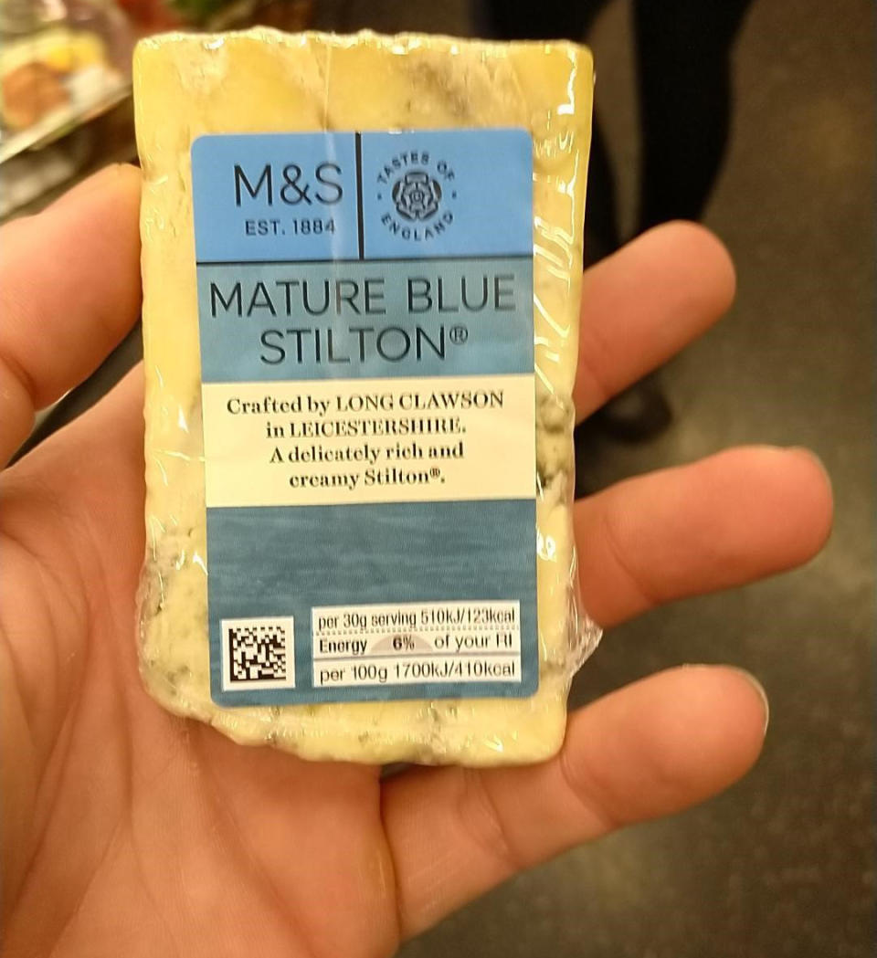 A piece of Mature Blue Stilton cheese is pictured.