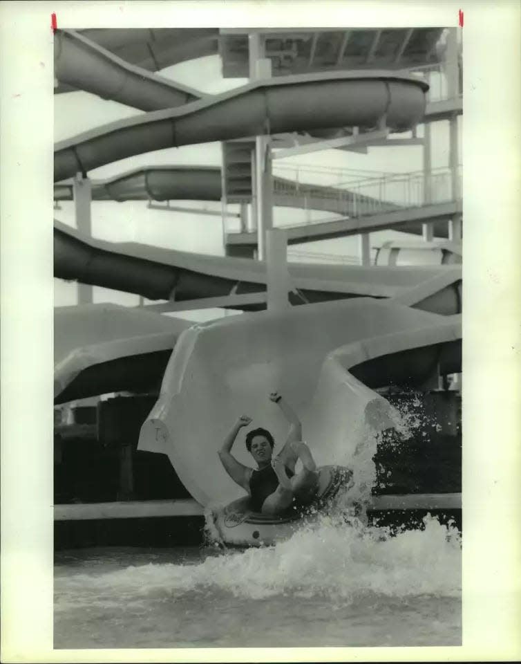 A person slides down a waterslide at Fame City Waterworks before it became Adventure Bay and eventually closed.