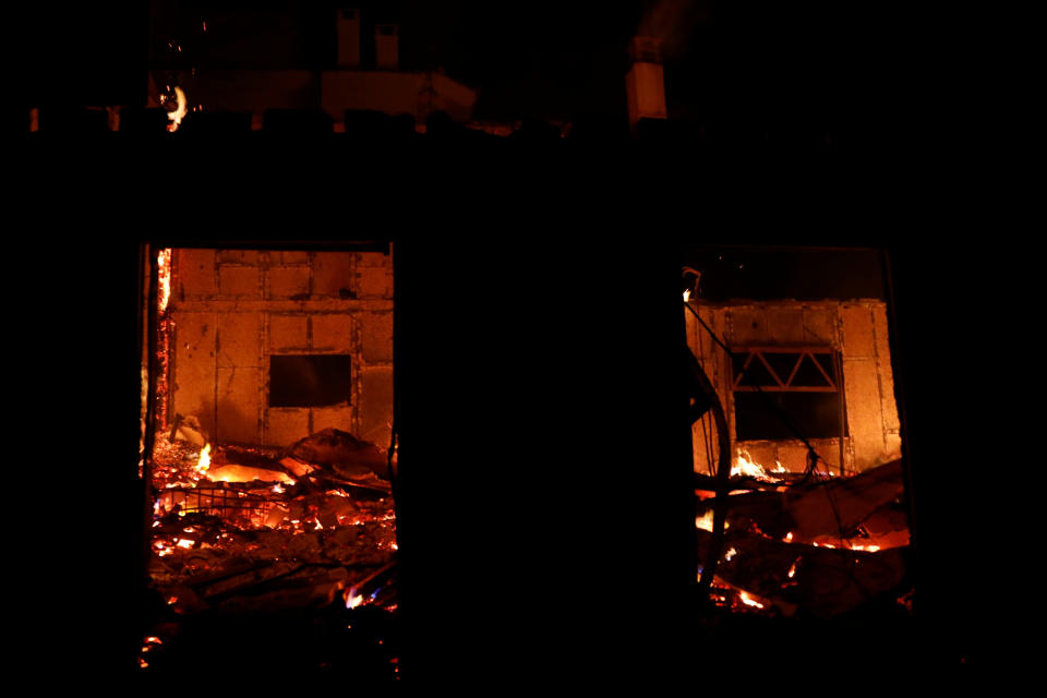 <p>A house burns as a wildfire rages at the village of Mati, near Athens, Greece, July 23, 2018. (Photo: Alkis Konstantinidis/Reuters) </p>