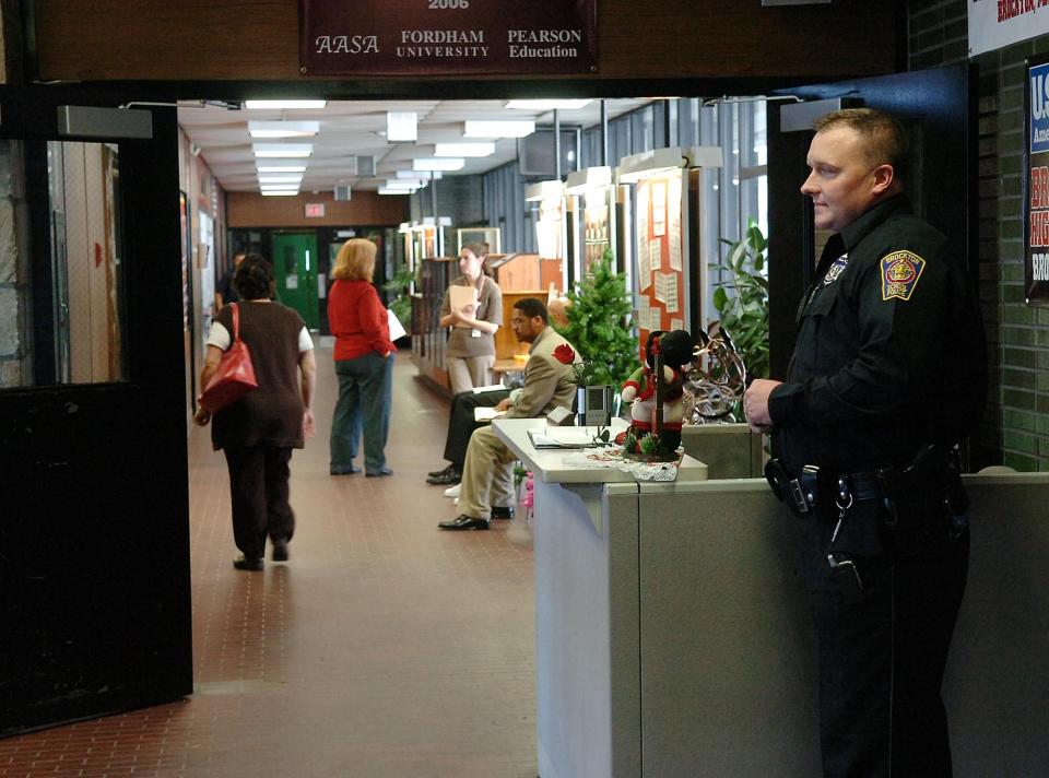 2009 File photo: School police supervisor Daniel Vaughn patrols inside Brockton High School the day after a former student was shot outside the gym.