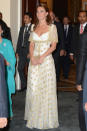 Kate wears a dress fit for a queen at the official dinner hosted by Malaysia's Head of State Sultan Abdul Halim Mu'adzam Shah of Kedah on Day 3 of her and Prince William's Diamond Jubilee Tour of South East Asia at the Istana Negara on Sept. 13, 2012 in Kuala Lumpur, Malaysia. The delicate gold and white Alexander McQueen gown is elegant and modern. That pattern? It's the hibiscus flower, which honours Malaysia. (Photo by Mark Large - Pool/Getty Images)