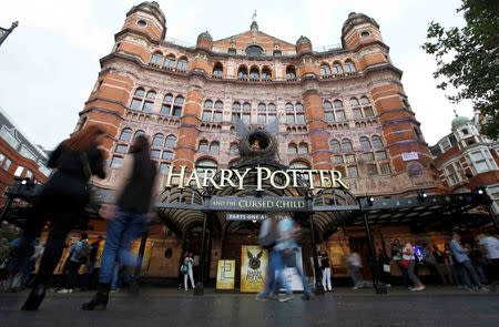 People walk past The Palace Theatre where the Harry Potter and The Cursed Child play is being staged, in London, Britain July 29, 2016. REUTERS/Peter Nicholls