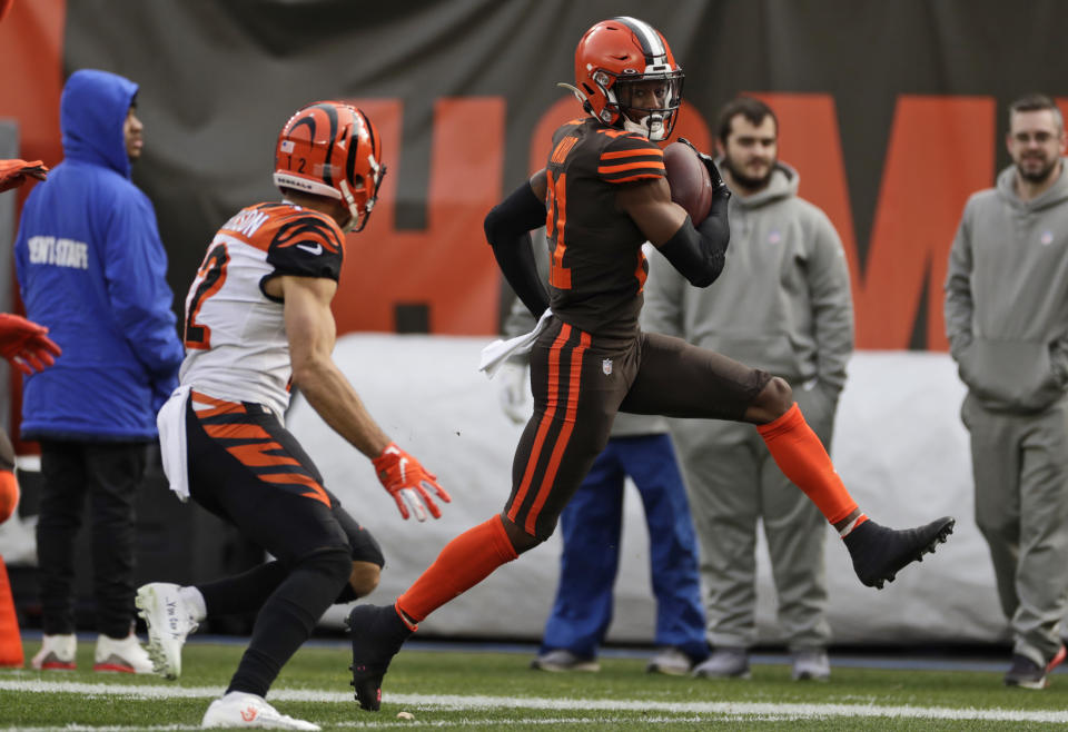 Cleveland Browns cornerback Denzel Ward scores on a 61-yard interception return during the first half of an NFL football game against the Cincinnati Bengals, Sunday, Dec. 8, 2019, in Cleveland. (AP Photo/Ron Schwane)