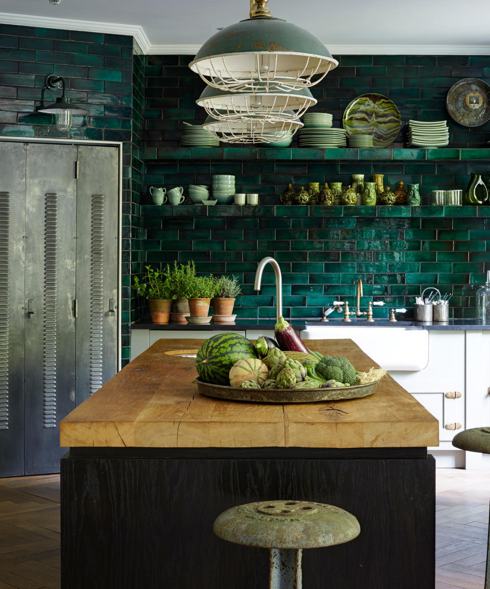 <p> Green is having something of a resurgence in the kitchen design space. 'Shades of green are an increasingly popular choice for kitchens,' says Helen Shaw, Benjamin Moore's UK Director. 'At the center point of the color wheel, green can adapt to both cool and warm schemes, working to tie varying hues together.' </p> <p> ‘The brief for this kitchen was to bring the greens of the garden indoors,’ says designer Hubert Zandberg. The glazed kitchen wall tiles set off the industrial notes, and natural wood provides a richly textured look. </p> <p> A well-lit room with clever kitchen lighting ideas will also help the color scheme stand out – take inspiration from the vintage-style pendant lights in this space. </p>