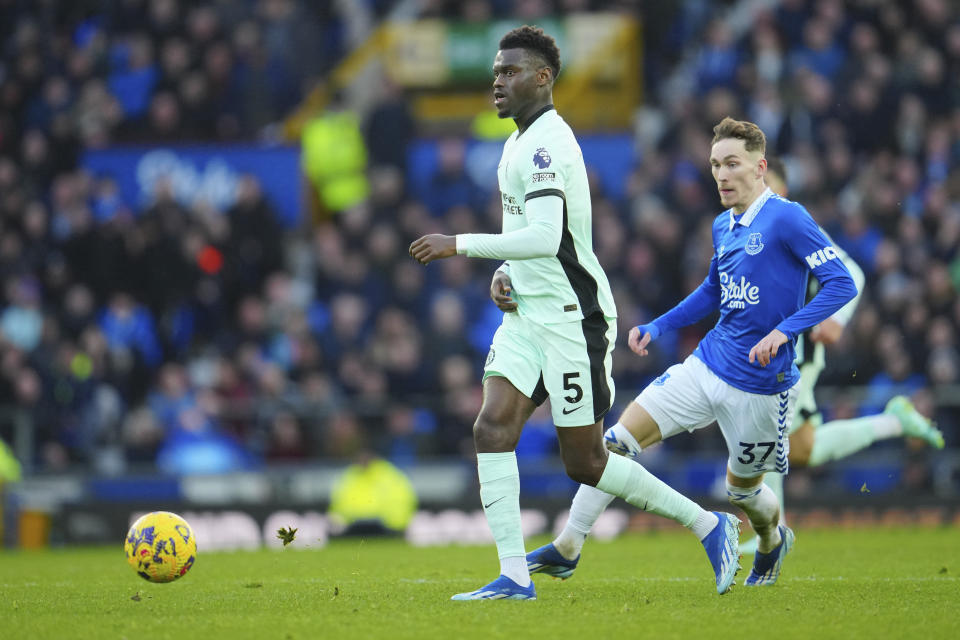 Chelsea's Benoit Badiashile, centre, and Everton's James Garner in action during the English Premier League soccer match between Everton and Chelsea, at Goodison Park Stadium, in Liverpool, England, Sunday, Dec.10, 2023. (AP Photo/Jon Super)