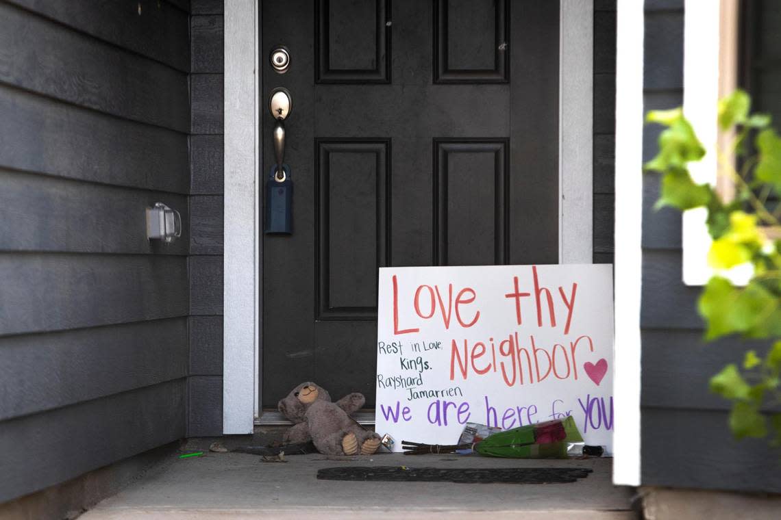 Flowers and other items sit at the door of a home in the Quarter Horse Estates neighborhood of Fort Worth on Monday, August 29, 2022, where a 5-year-old and a 17-year-old were fatally shot on Sunday. A toddler was also hurt, but is expected to survive.