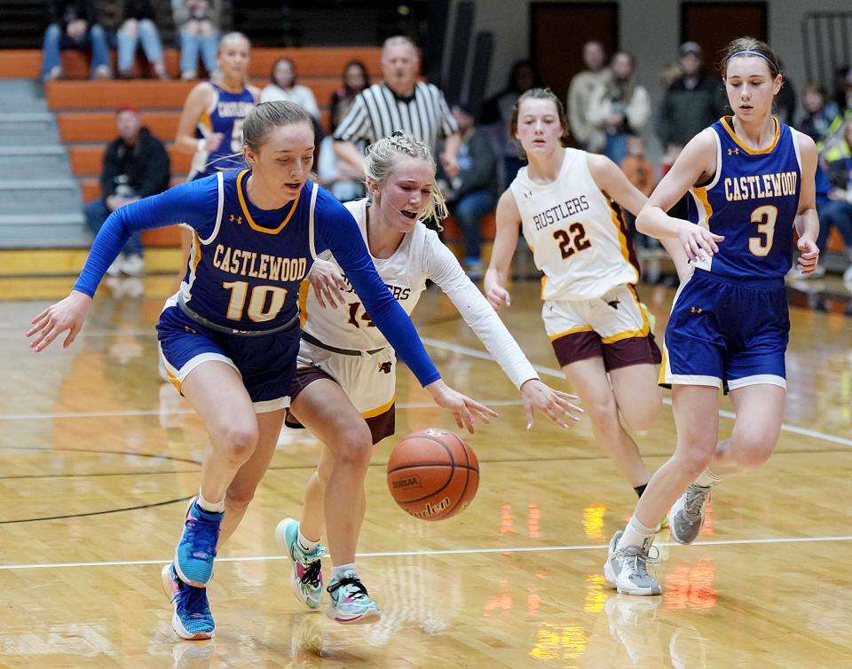 Castlewood's Mackenzie Everson and Ethan's Ava Lingemann battle for a loose ball during their first-round game in the state Class B high school girls basketball tournament on Thursday, March 9, 2023 in the Huron Arena. Looking on are Castlewood's Presley Knecht and Ethan's Ella Pollreisz (22). Ethan won 55-53 in overtime.