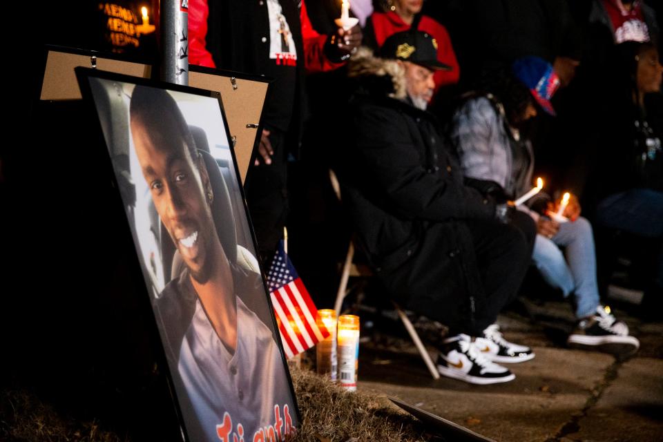 A photo of Tyre Nichols can be seen as Rodney and RowVaughn Wells, the parents of Nichols, hold a candle and bow their heads in prayer during a candlelight vigil for Nichols held at the site where he was beaten to death by Memphis Police Department officers on the one year anniversary of his death in Memphis, Tenn., on Sunday, January 7, 2024.
