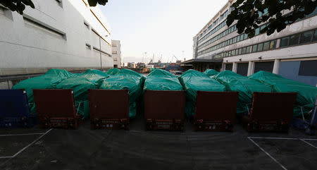 Armored troop carriers, belonging to Singapore, are detained at a cargo terminal in Hong Kong, China November 28, 2016. REUTERS/Bobby Yip