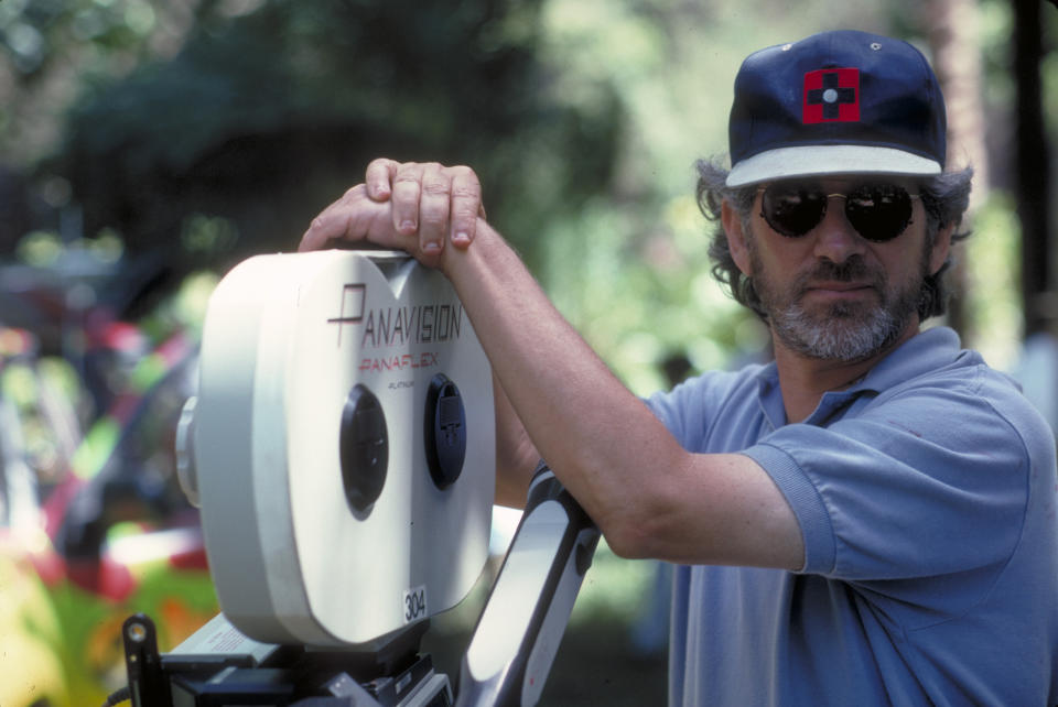 Steven Spielberg poses with a Panaflex camera on the set of Jurassic Park