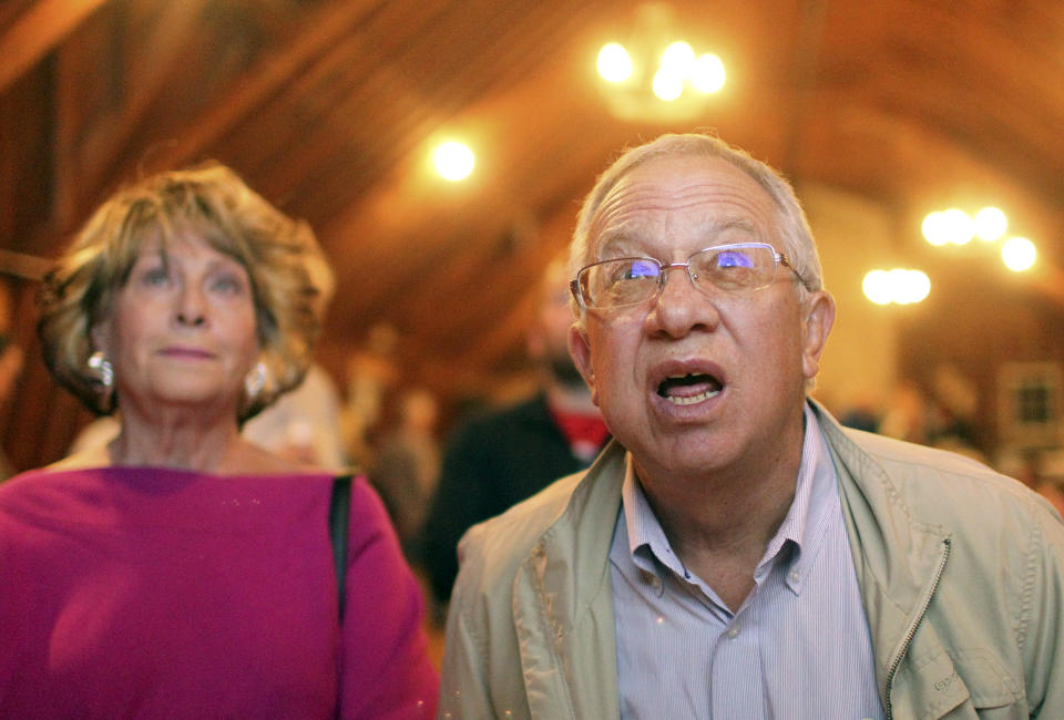 Supporter Bill Foster squints as results come in at the watch party for Republican gubernatorial candidate Sam Galeotos at the latter's residence on Tuesday, Aug. 21, 2018, in rural Laramie County, Wyo. (Jacob Byk/The Wyoming Tribune Eagle via AP)