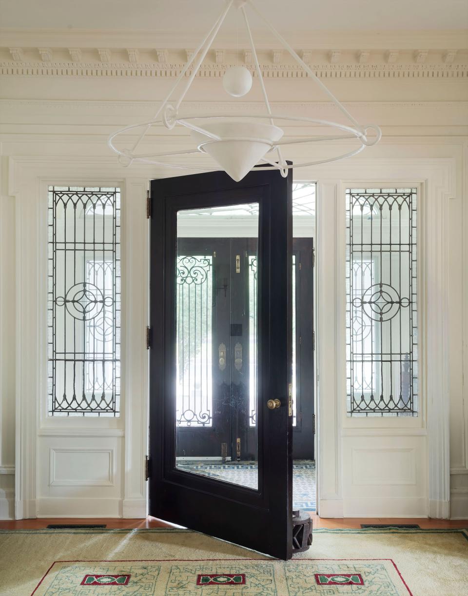 Meticulously restored historic details help make for a beautiful entryway.