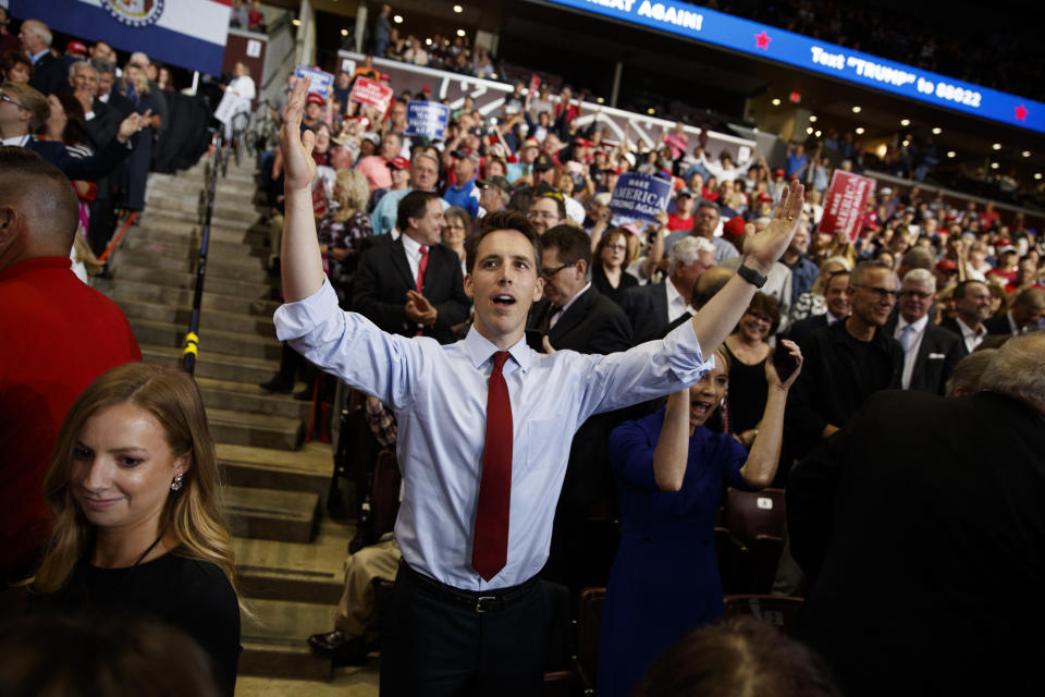 Republican Senate candidate Josh Hawley dances before President Donald Trump speaks during a campaign rally, Friday, Sept. 21, 2018, in Springfield, Mo. (AP Photo/Evan Vucci)