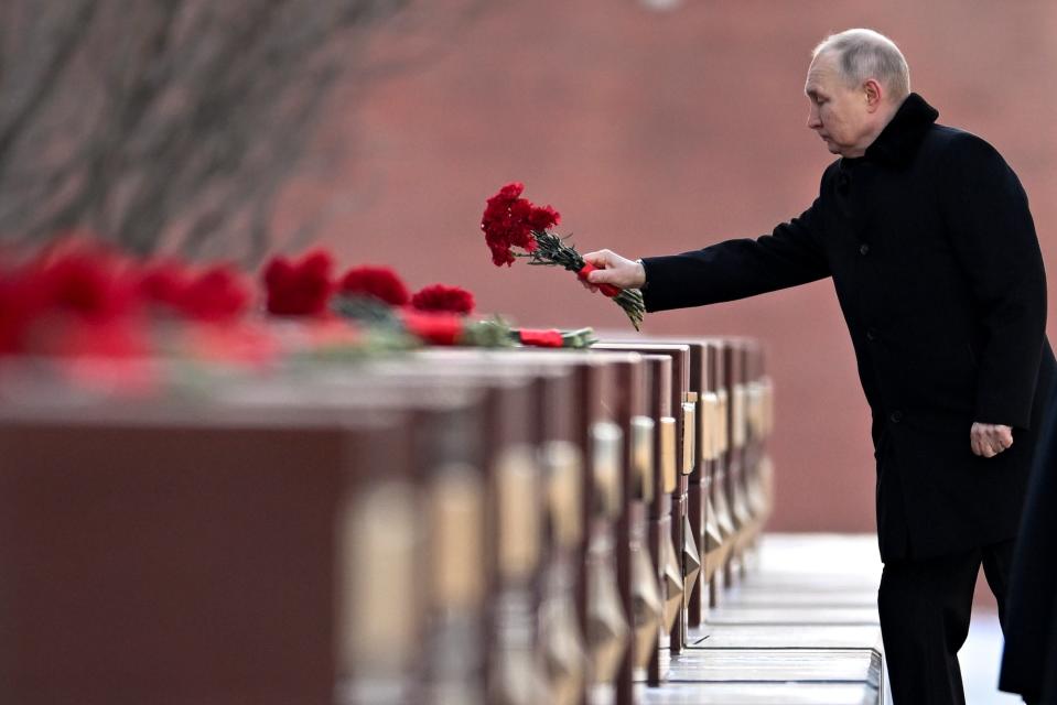Vladimir Putin attends a ceremony on Sunday (AP)