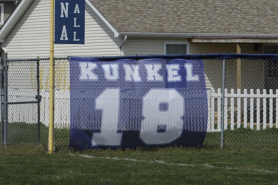 Adena baseball retired No. 18 in a ceremony honoring late alumni Eli Kunkel before its season opener against McClain on March 23, 2024, in Frankfort, Ohio.