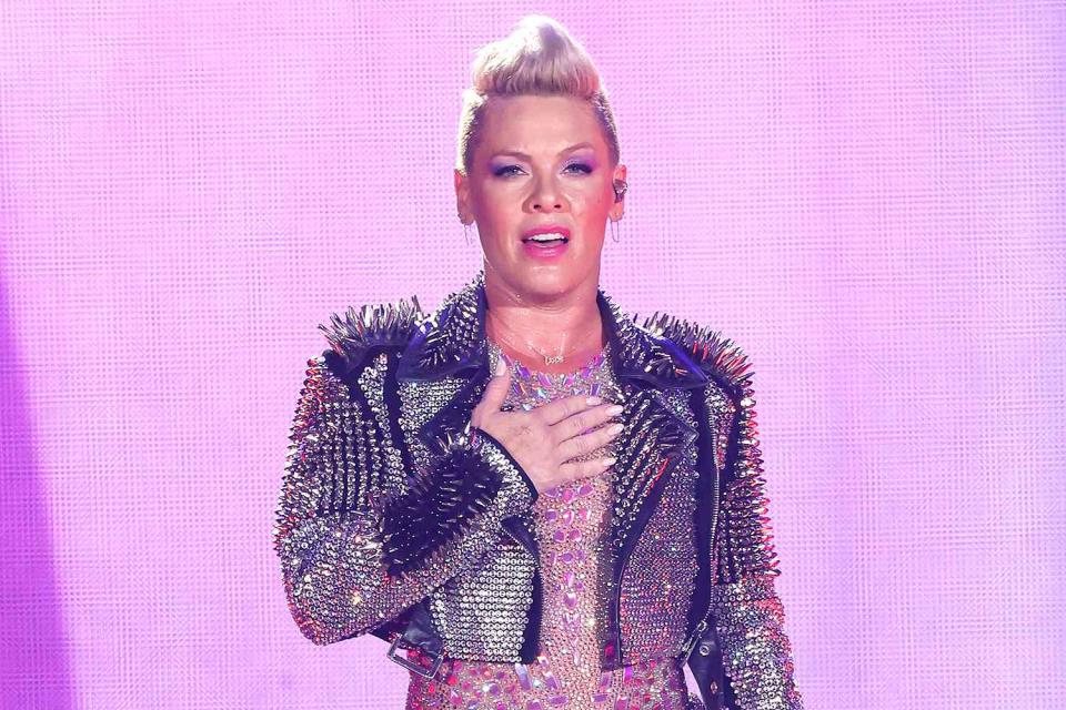 <p>Jason Kempin/Getty</p> Pink rescheduled her Arlington, Texas tour stop due to a "bad sinus infection."