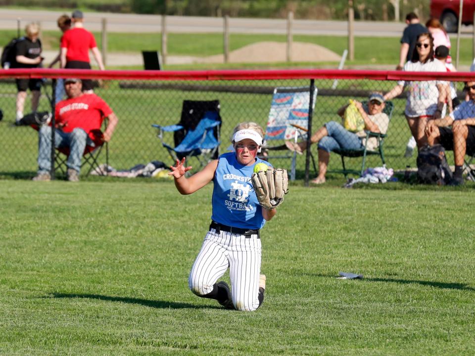 Gracie Peck makes a sliding catch in center field during Crooksville's 12-0 loss to visiting West Muskingum on Monday in McLuney. The Ceramics fell to 7-3 overall.