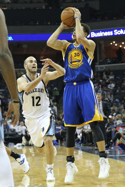 Mar 27, 2015; Memphis, TN, USA; Golden State Warriors guard Stephen Curry (30) attempts a shot in the second half against Memphis Grizzlies guard Nick Calathes (12) at FedExForum. Warriors defeated the Grizzlies 107-84. (Nelson Chenault-USA TODAY Sports)