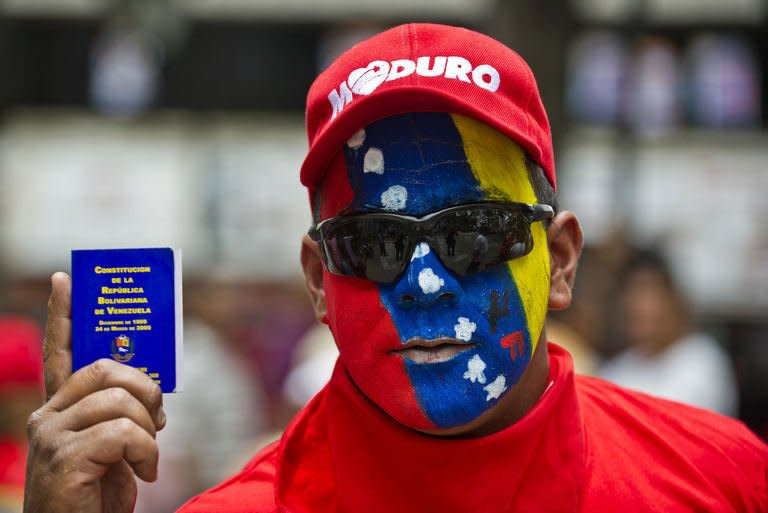A supporter of Venezuelan President Nicolas Maduro demonstrates against opposition leader Henrique Capriles, in Los Teques, Miranda State, on April 17, 2013. Venezuela's Supreme Court on Wednesday ruled out a recount of a disputed presidential vote won by the late Hugo Chavez's political heir Nicolas Maduro, upping the pressure on his rival to concede