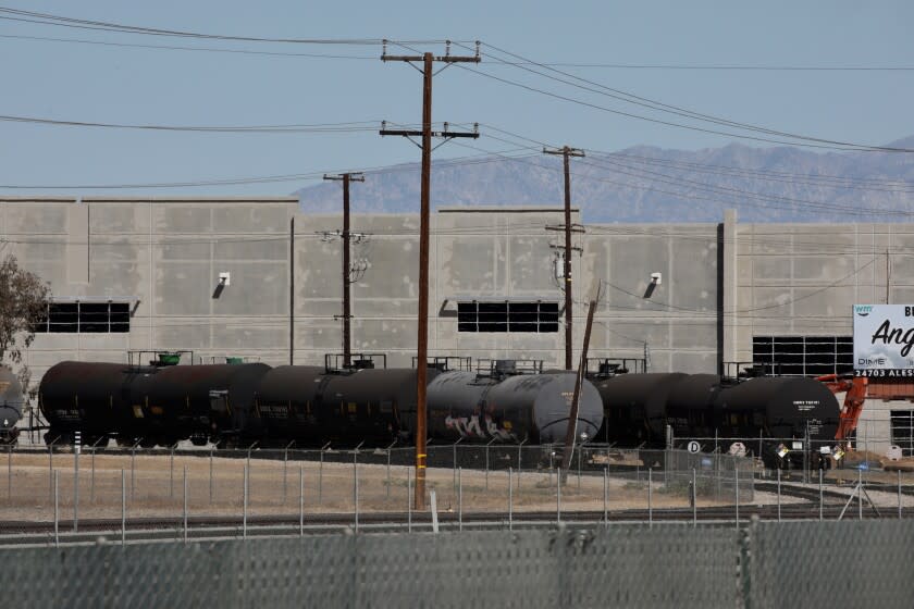 PERRIS CA AUGUST 12, 2022 - A chemical leak from a rail cars located on a spur just off the main tracks has led to the closure of a portion of the 210 freeway in both directions in Perris, Friday August 12, 2022. Officials discovered that a rail car had spilled a substance styrene, a highly volatile liquid typically used in plastic and rubber products, and was dangerously overheated. (Irfan Khan / Los Angeles Times)