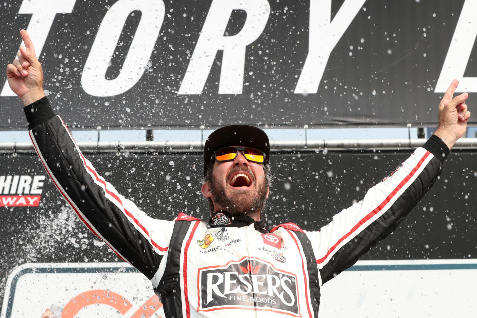 LOUDON, NEW HAMPSHIRE - JULY 17: Martin Truex Jr., driver of the #19 Reser's Fine Foods Toyota, celebrates in victory lane after winning the NASCAR Cup Series Crayon 301 at New Hampshire Motor Speedway on July 17, 2023 in Loudon , New Hampshire.  (Photo by Meg Oliphant/Getty Images)