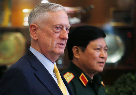 U.S. Secretary of Defense Jim Mattis (L) and Vietnam's Defence Minister General Ngo Xuan Lich leave a meeting room in Ho Chi Minh city, Vietnam October 17, 2018. REUTERS/Kham/Pool