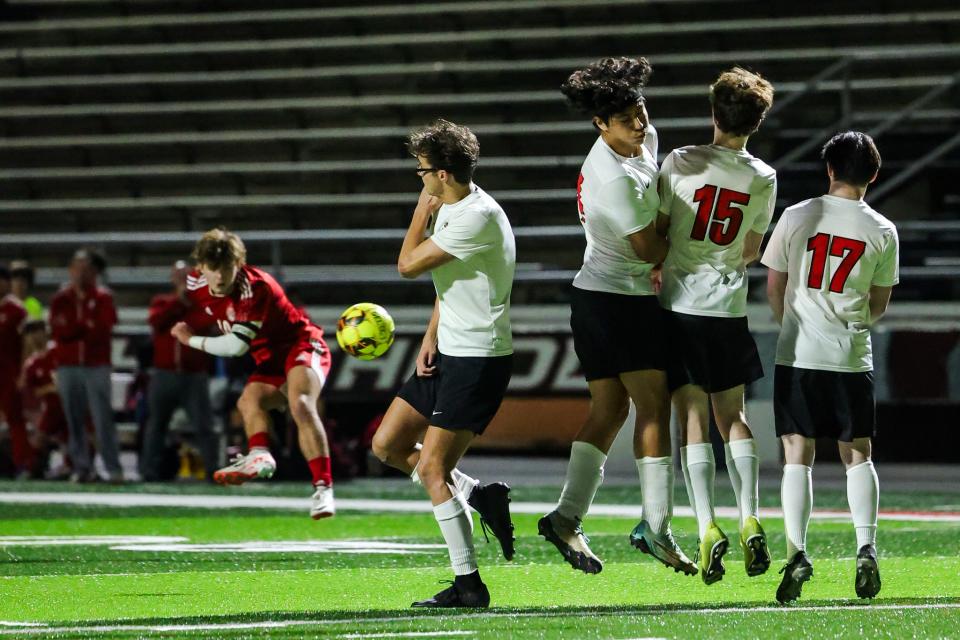 Caddo Magnet’s wall of defenders blocking a kick by Haughton's Carter Ebarb (10) during the Division II district championship on Monday, January 29, 2024, at Preston Crownover Stadium.