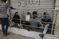 People stage a sit-in demanding a return to civilian rule and to protest the nine people who were killed in anti-military demonstrations last month, in Khartoum, Sudan, Monday, July 4, 2022. (AP Photo/Marwan Ali)