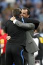 Wigan Athletic manager Roberto Martinez (right) celebrates winning the FA Cup final on the pitch after the game