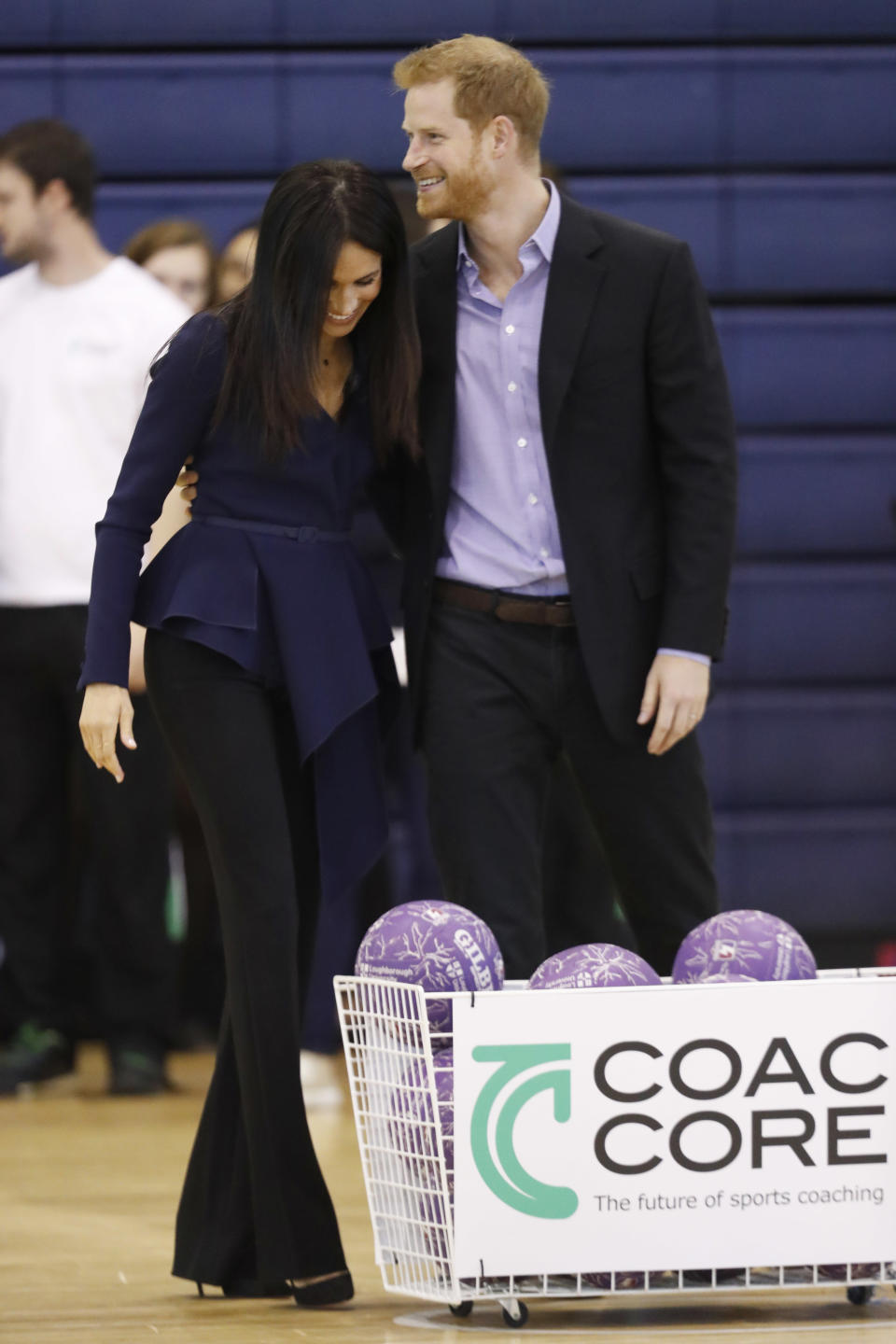 The royal couple showed off their competitive sides, before sharing a cuddle (Getty)