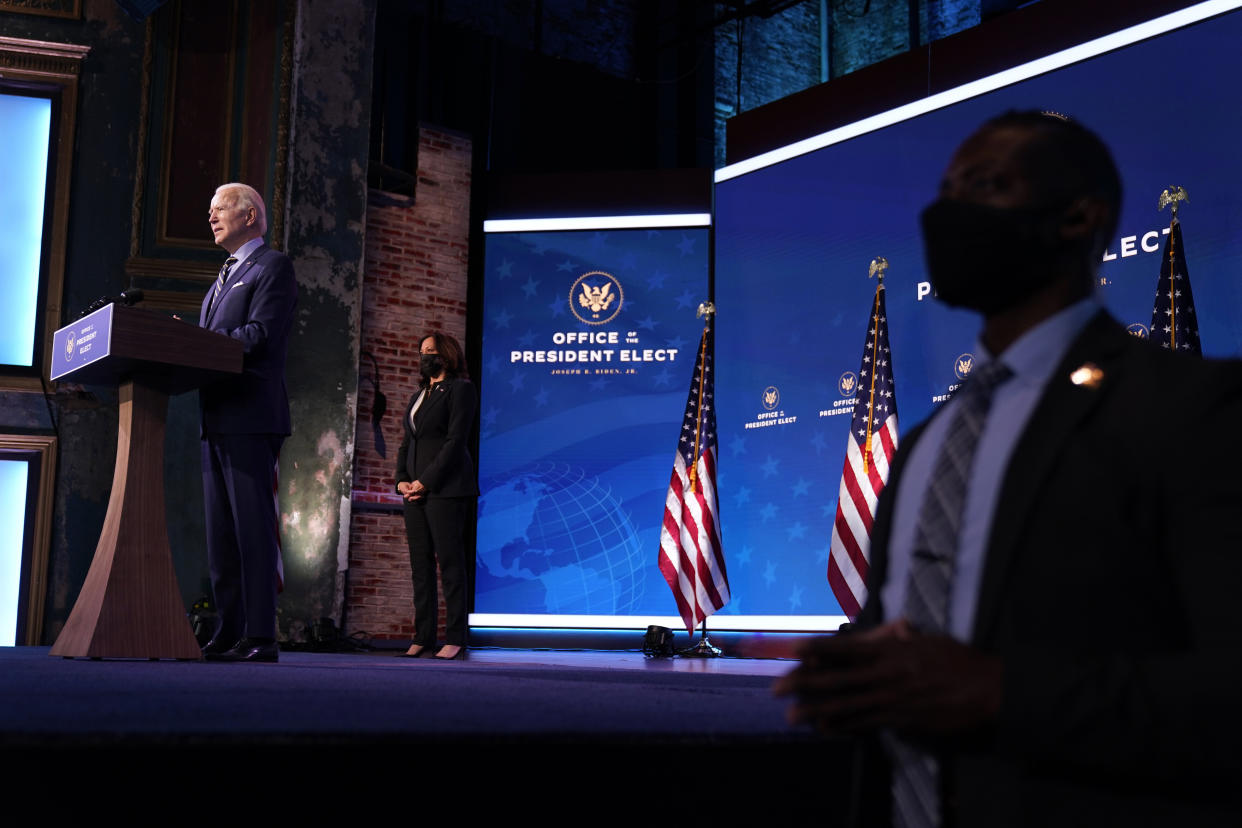 President-elect Joe Biden speaks Monday in Wilmington, Delaware. Vice President-elect Kamala Harris (center) listens. (Photo: Andrew Harnik/ASSOCIATED PRESS)