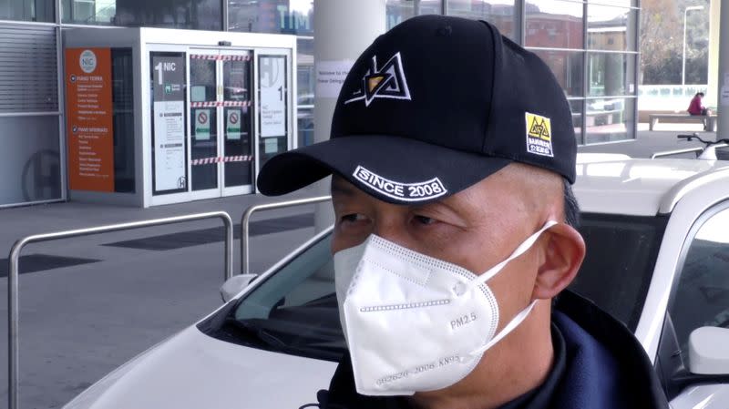 Businessman Luca Zhou, 56, wearing a face mask is seen on the streets of Prato, home to the biggest ethnic Chinese community in Italy