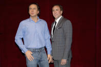 U.S. actor Nicolas Cage (R) stands next to his figure at the Grevin wax museum during the presentation of his waxwork in Paris January 29, 2012. REUTERS/ Gonzalo Fuentes