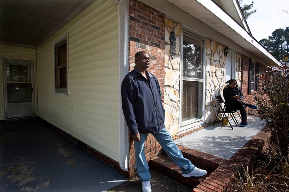 Henry McCollum, 50, spends time outdoors with his sister, Geraldine Brown, 49, rear, in Fayetteville, N.C. “I’m happy to be out here breathing the cool air,” he says. He and his brother Leon Brown, 47, not seen, both served 31 years for a rape and murder of a young girl which they did not commit. They were freed in September 2014. Both are happy to out of prison, but find that it’s been a hard adjustment on the outside. They have no income and no car, which makes it difficult to find work and earn money.