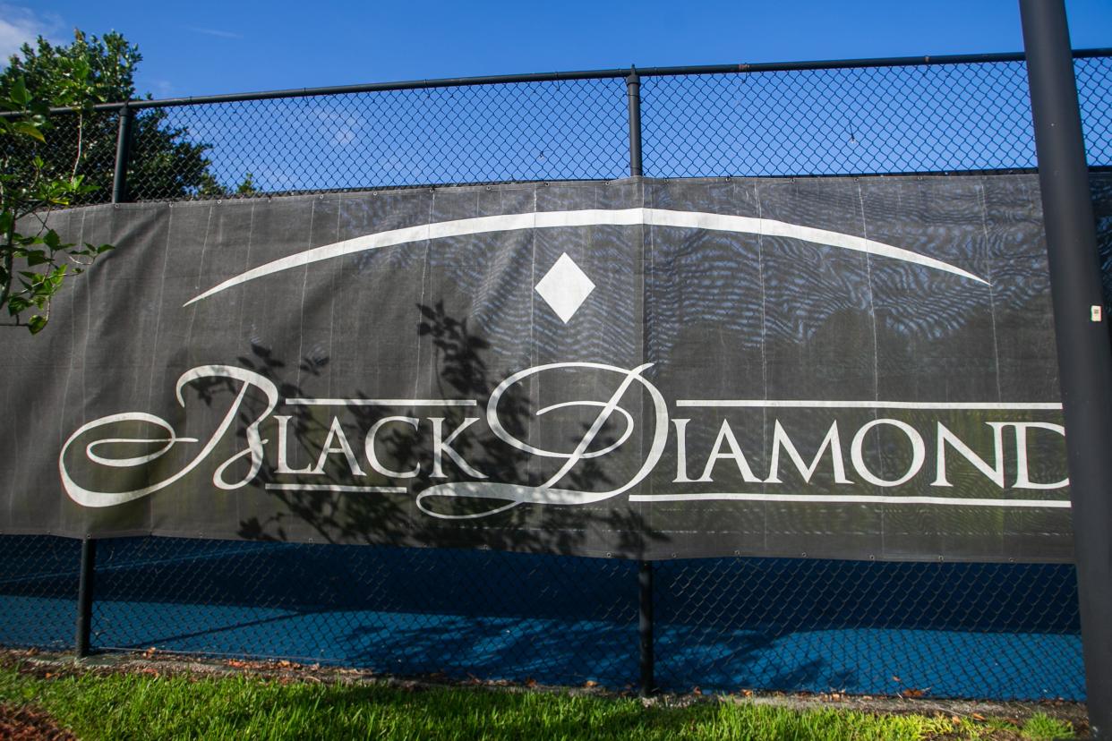 Pictured is Black Diamond community signage by the neighborhood tennis courts in Wellington. A year ago, homeowner Rick Darquea accused the homeowners association board of conducting a fraudulent election.